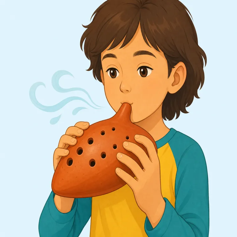 ocarina（オカリナ・名詞）の覚え方イラスト — 日本語の「オカリナ」と英語 ocarina はほぼ同じなので、意味そのものより“どんな笛か”を像で固定すると強いです